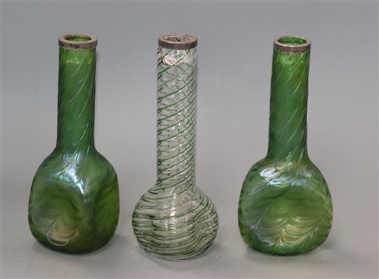 Three silver-rimmed iridescent glass vases